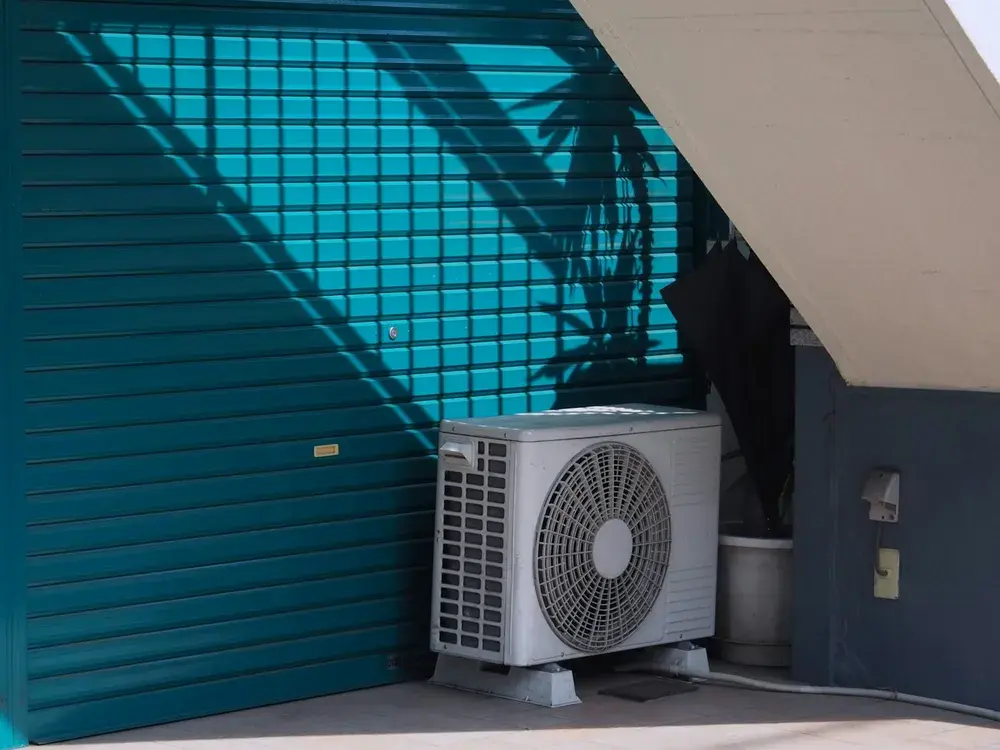 New AC condenser installed on a sunlit Los Angeles, CA patio