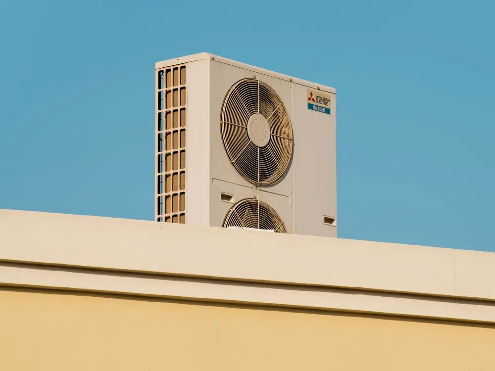 Newly installed energy-efficient AC unit under a clear Los Angeles, CA sky