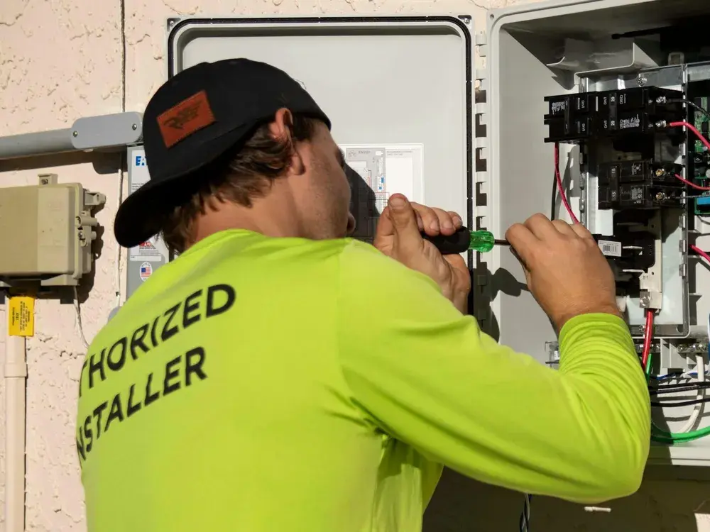 Technician diagnosing electrical controls during an AC repair visit in Los Angeles, CA