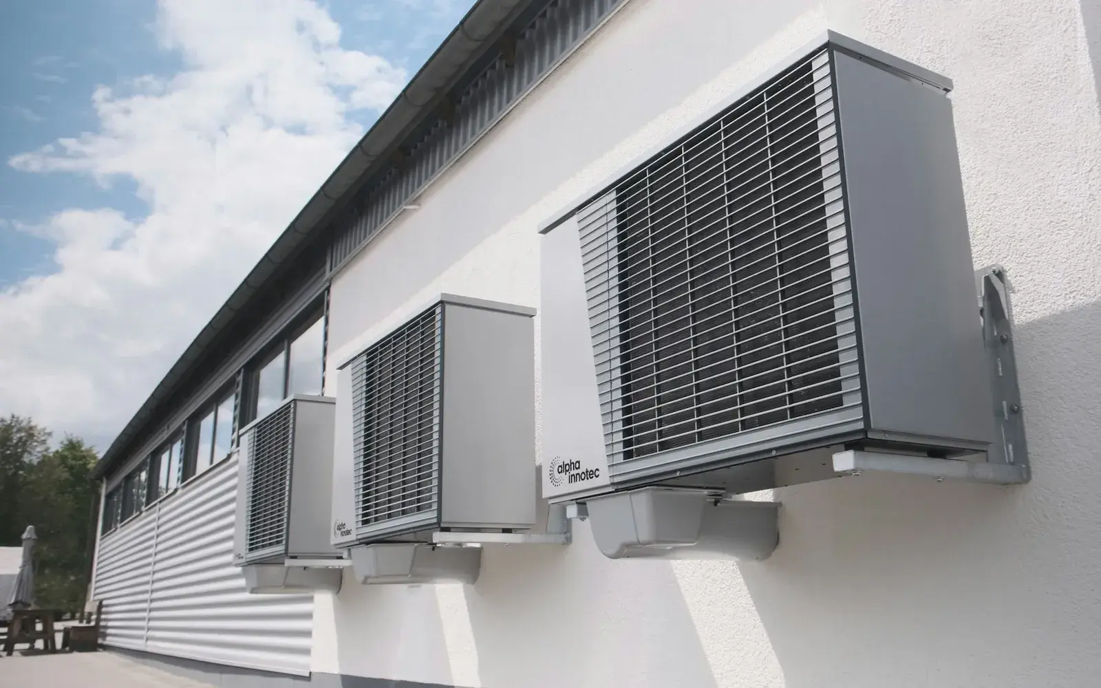 Modern high-efficiency replacement AC condensers on a clean exterior wall in Los Angeles, CA