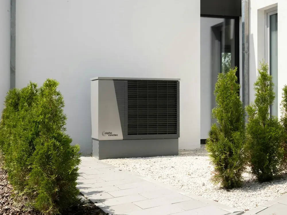 Modern heat pump condenser outside a Los Angeles area home