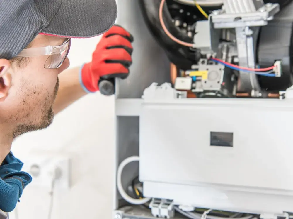 A/D technician servicing a furnace and heat pump system in Los Angeles, CA